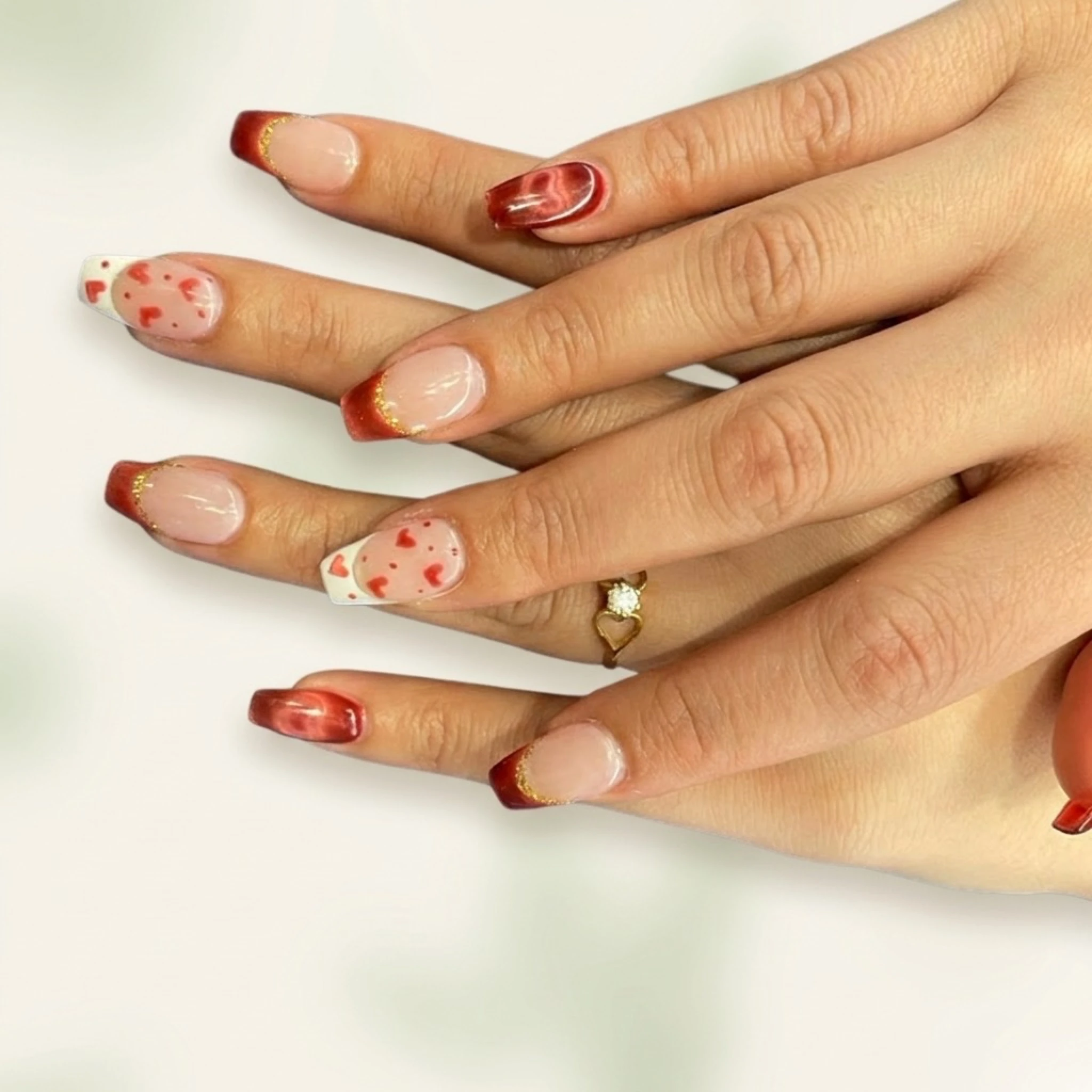 Valentine heart nail art with copper French tips — romantic nail design